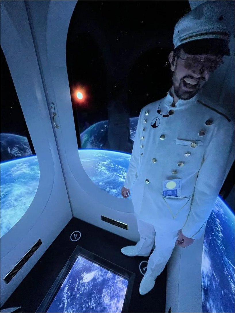 The elevator captain, with Earth below
