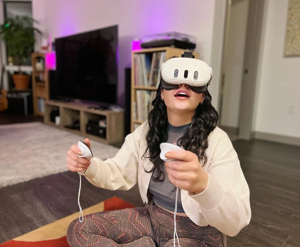 A tester riding the elevator in a VR headset